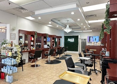 Elegant interior of Act II Salon in Fairfax, Virginia, US, showcasing stylish chairs and modern decor.