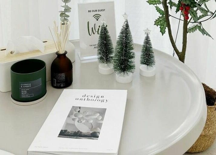 Cozy decor setup with candles and mini trees at Haho Hair, Krung Thep Maha Nakhon, TH for a serene ambiance.