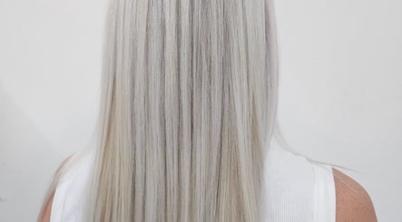 Straight platinum blonde hair styled at Gemma Fifty Eight Hair Design, Gillingham, England, GB.