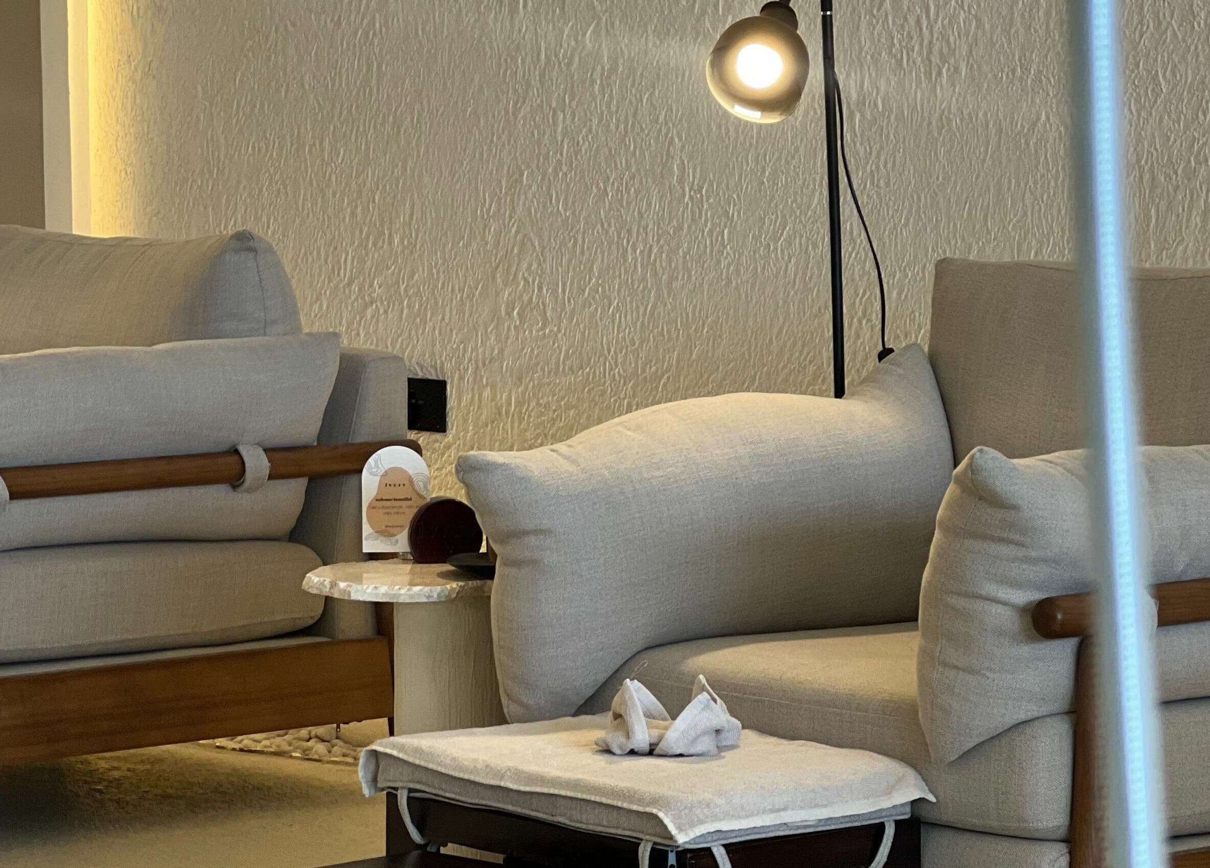 Comfortable seating area at Ivory Nail Spa in Bisha, Aseer Province, SA, offering a relaxing ambiance.