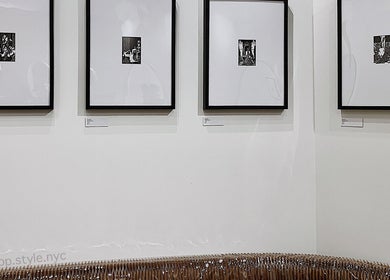 Framed art pieces on stylish wall at Nonstop Style 11, New York, New York, US. Elegant gallery atmosphere.