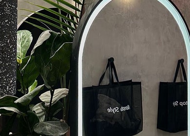 Elegant mirror reflecting lush plants at Nonstop Style 33, New York, New York, US.