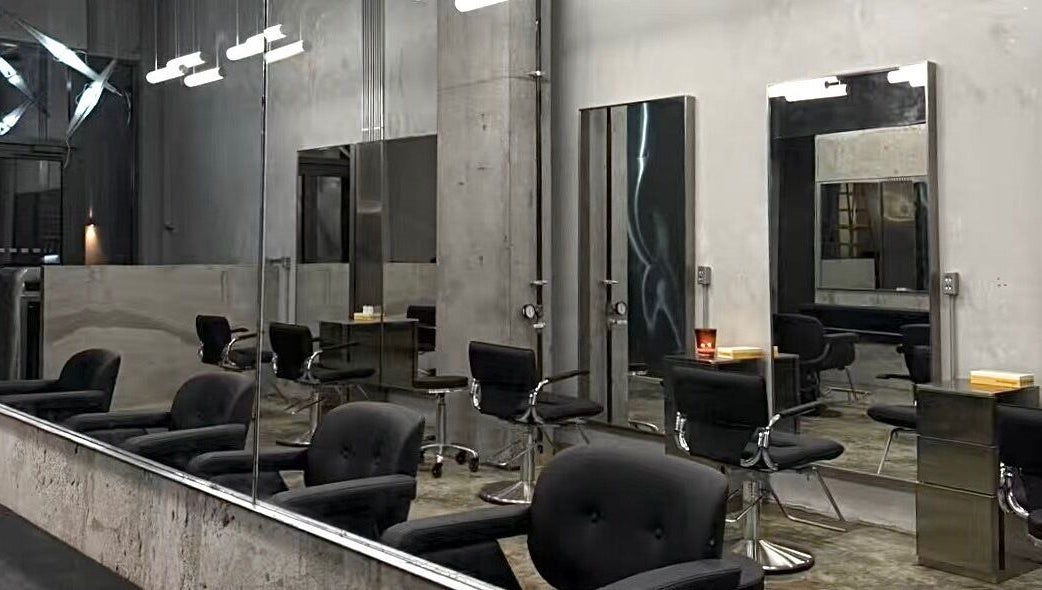 Modern salon chairs and mirrors at Nonstop Style LIC, New York, New York, US. Contemporary design and ambiance.