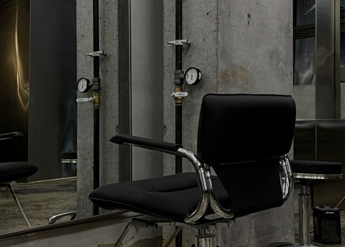 Modern salon chair at Nonstop Style LIC in New York, New York, US showcasing sleek decor and industrial style.