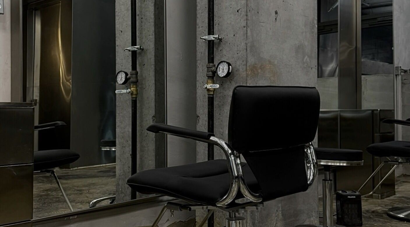 Modern salon chair at Nonstop Style LIC in New York, New York, US showcasing sleek decor and industrial style.