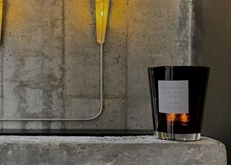 A sleek black candle creates a calming atmosphere at Nonstop Style LIC, New York, New York, US.