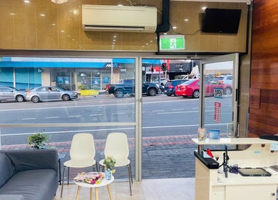 Reception area with cozy lounge at Ease’s Nail and Beauty Caringbah, Caringbah, New South Wales, AU.