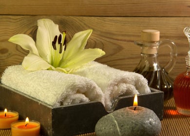 Luxurious spa setting at The WAY, Taunggyi, Shan, MM. White towels, candles, and oils for a serene experience.