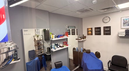 Interior of José J&DBarbers Studio in Manchester, England, GB with barber chairs and chic decor.