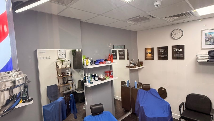 Interior of José J&DBarbers Studio in Manchester, England, GB with barber chairs and stylish decor.