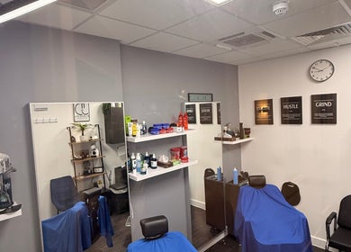 Interior of José J&DBarbers Studio in Manchester, England, GB with barber chairs and stylish decor.