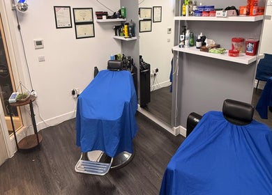 Chic interior of José J&DBarbers Studio in Manchester, England, GB with stylish grooming stations.