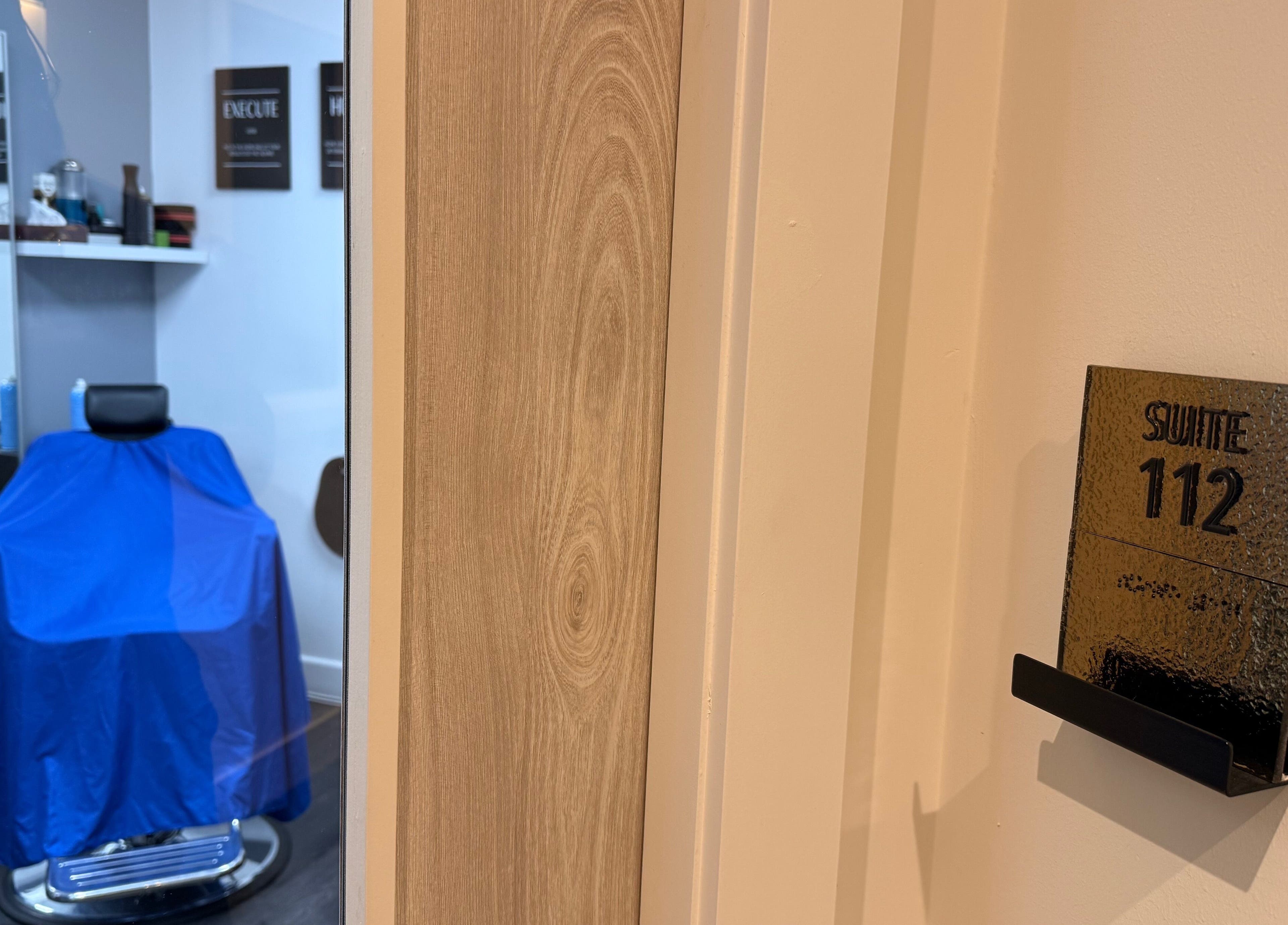 Chic interior of José J&DBarbers Studio, Suite 112, Manchester, England, GB showcasing salon chair and decor.