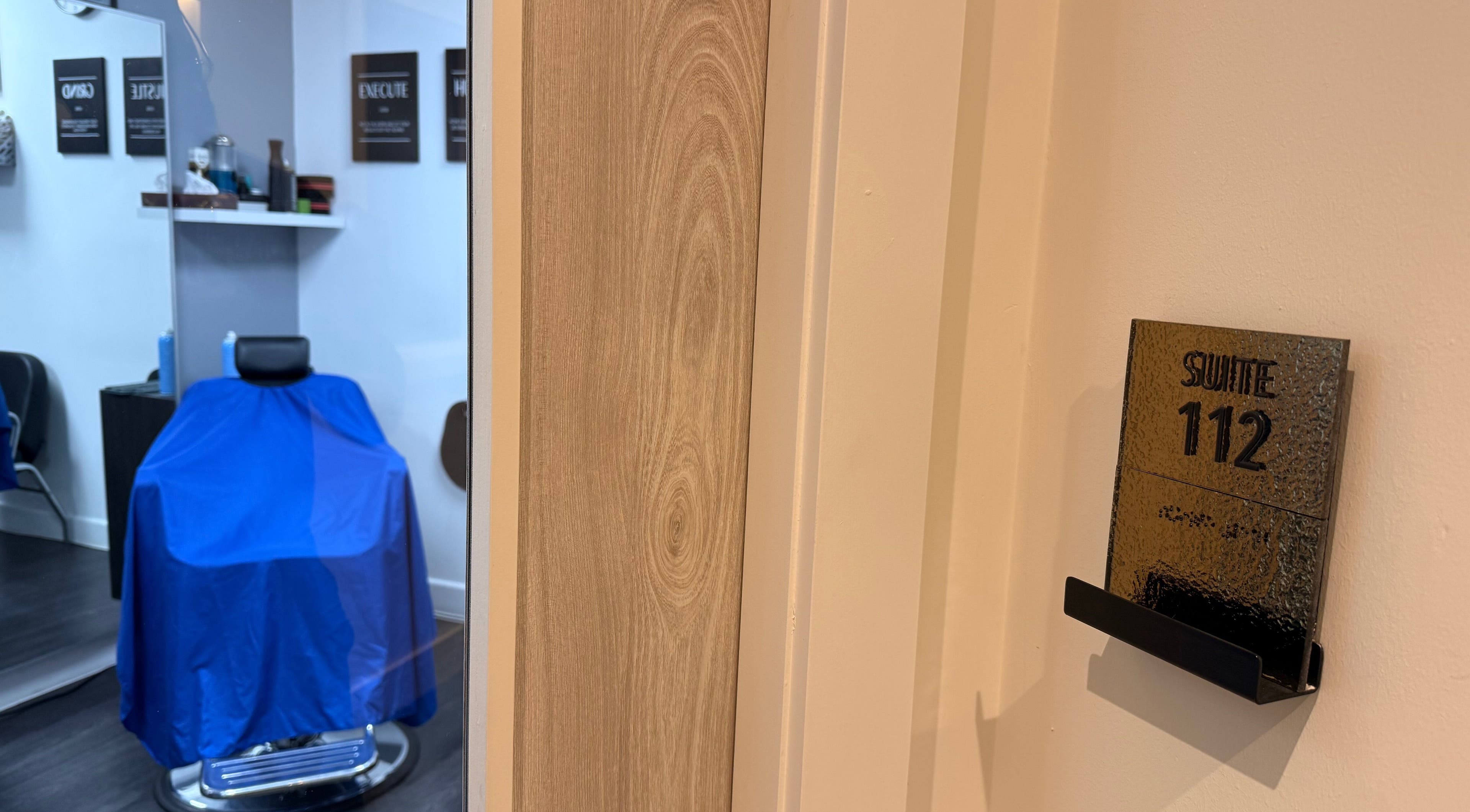 Chic interior of José J&DBarbers Studio, Suite 112, Manchester, England, GB showcasing salon chair and decor.