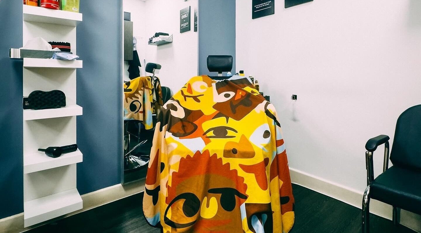 Colorful barber chair at José J&DBarbers Studio in Manchester, England, GB showcasing unique design.
