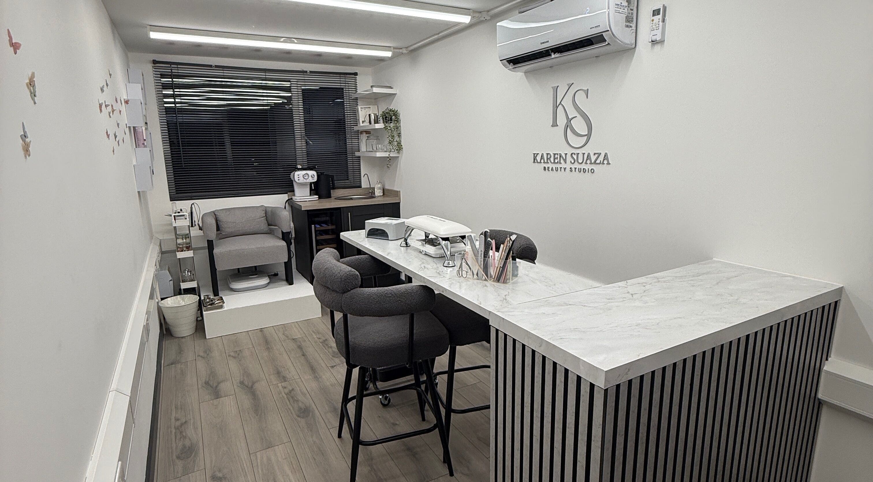 Interior view of KS Karen Suaza Beauty Studio in Brookwood, England, GB, showcasing stylish furniture and decor.