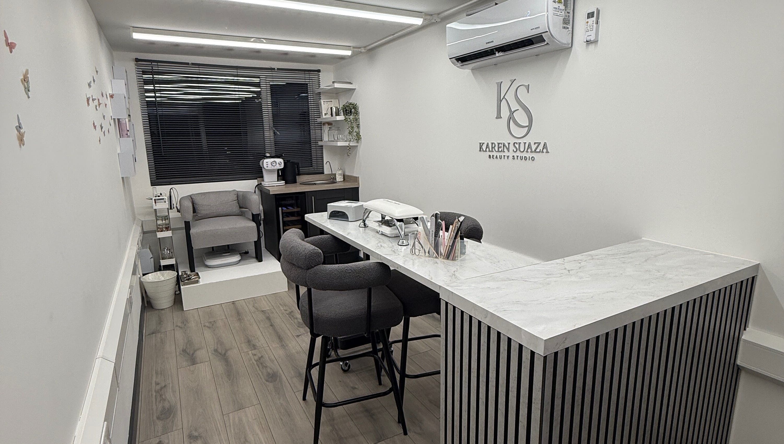 Modern interior of KS Karen Suaza Beauty Studio in Brookwood, England, GB showcasing sleek furniture and decor.