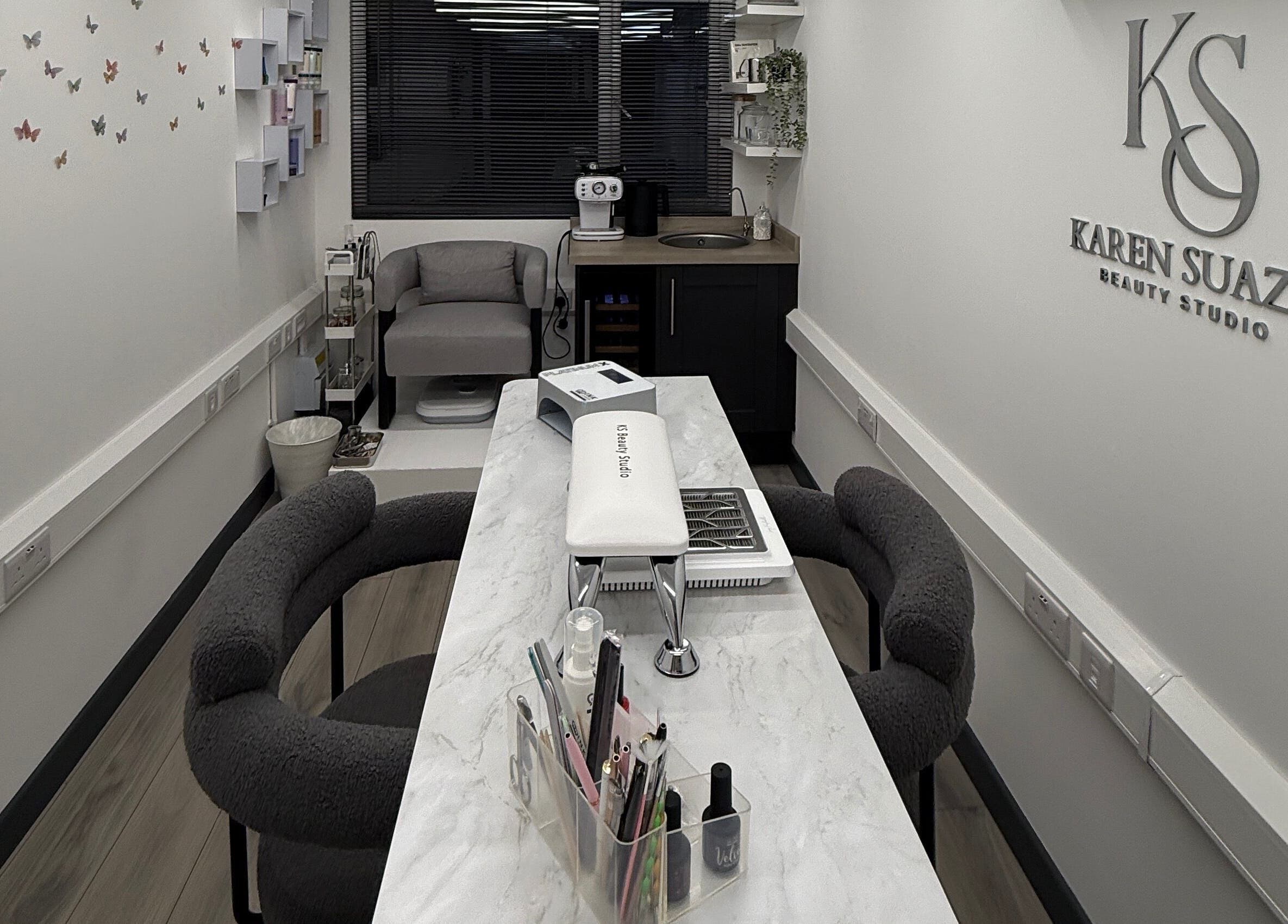 Modern interior of KS Karen Suaza Beauty Studio in Brookwood, England, GB, featuring elegant decor and seating.