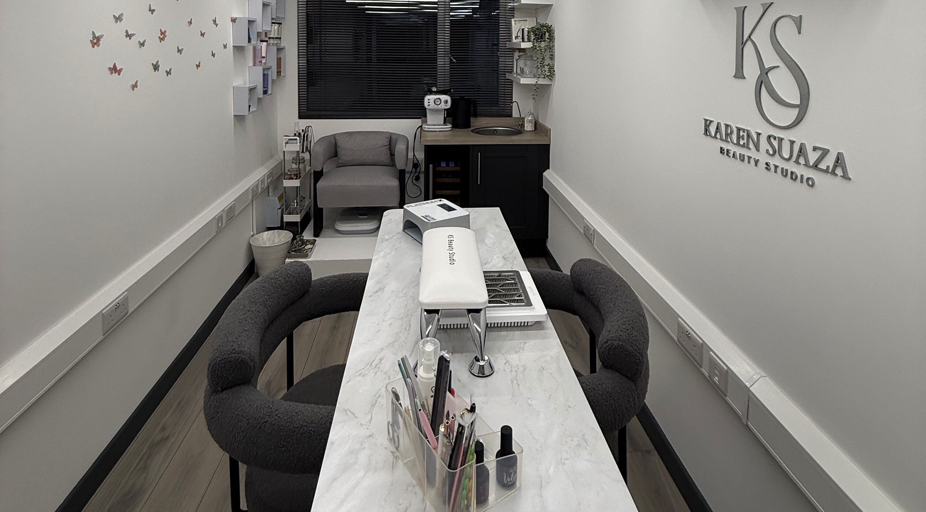 Modern interior of KS Karen Suaza Beauty Studio in Brookwood, England, GB, featuring elegant decor and seating.