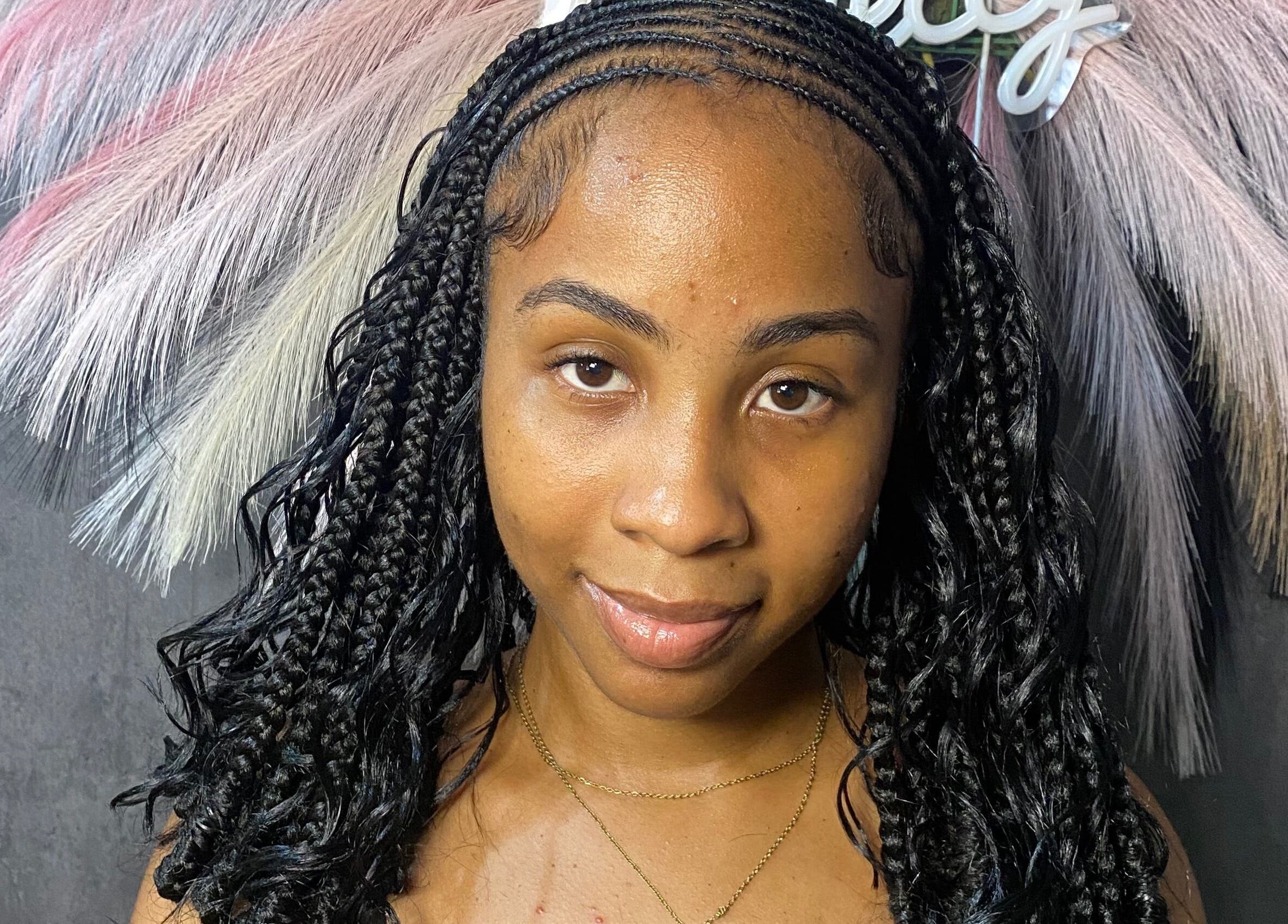 Intricate cornrows at Braided by Kie, Roseau, DM, showcasing detailed artistry in modern hairstyling.