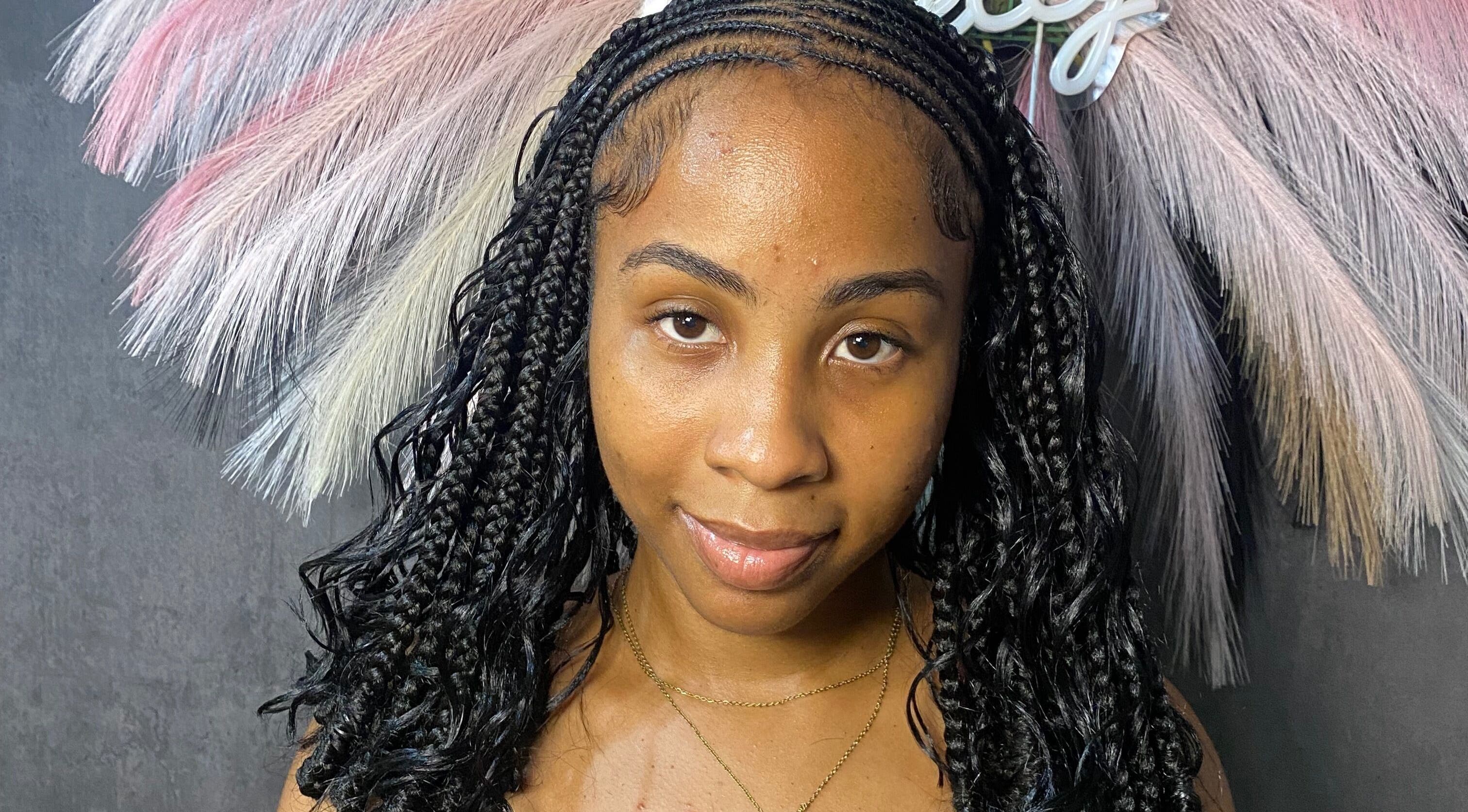 Intricate cornrows at Braided by Kie, Roseau, DM, showcasing detailed artistry in modern hairstyling.