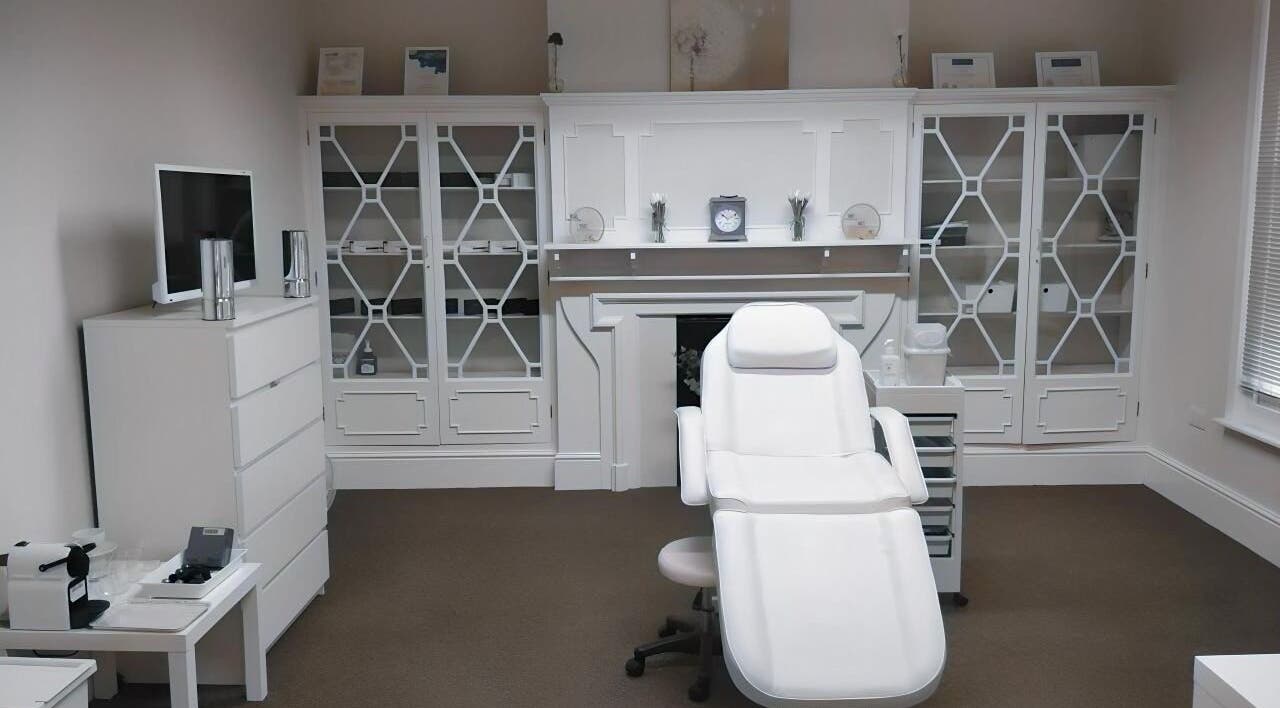 Elegant treatment room at Jnc Aesthetics, Eastbourne, England, GB, showcasing a white luxury spa chair.