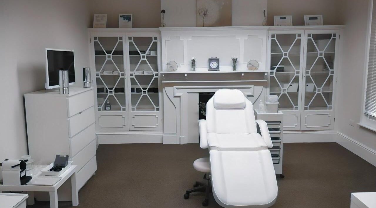 Elegant treatment room at Jnc Aesthetics, Eastbourne, England, GB, showcasing a white luxury spa chair.