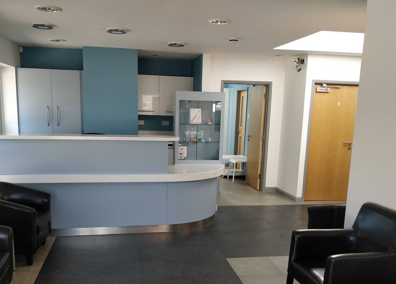 Modern reception area of Jnc Aesthetics in Eastbourne, England, GB featuring sleek decor and comfortable seating.
