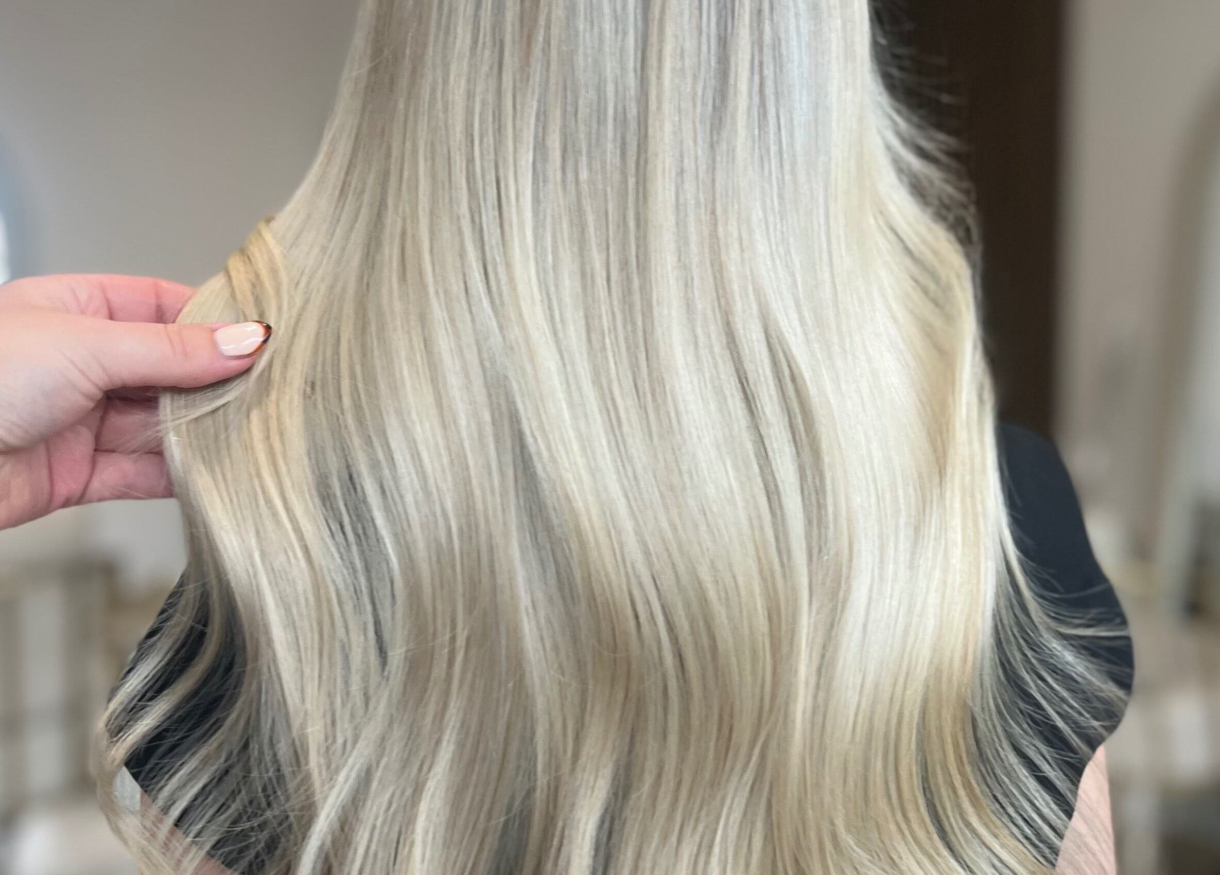 Smooth platinum blonde hair styled at Carrie Fern Price Hair, Chesterfield, England, GB.