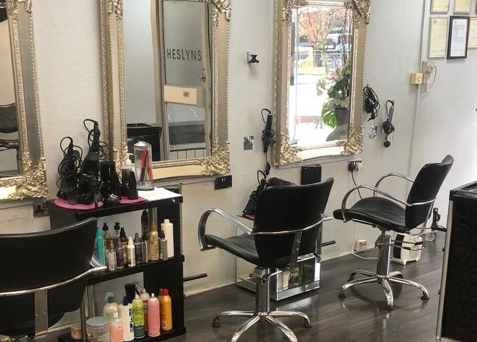 Elegant salon setup at Salon Four 13, Coventry, England, GB, featuring ornate mirrors and styling stations.