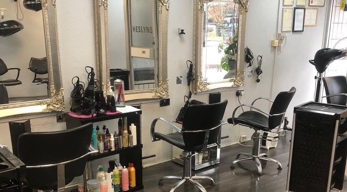 Elegant salon setup at Salon Four 13, Coventry, England, GB, featuring ornate mirrors and styling stations.