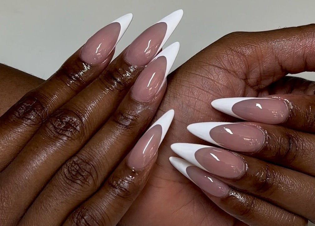 Elegant French manicure at Babe Cave Beauty in Atlanta, Georgia, US, showcasing stylish nail art.