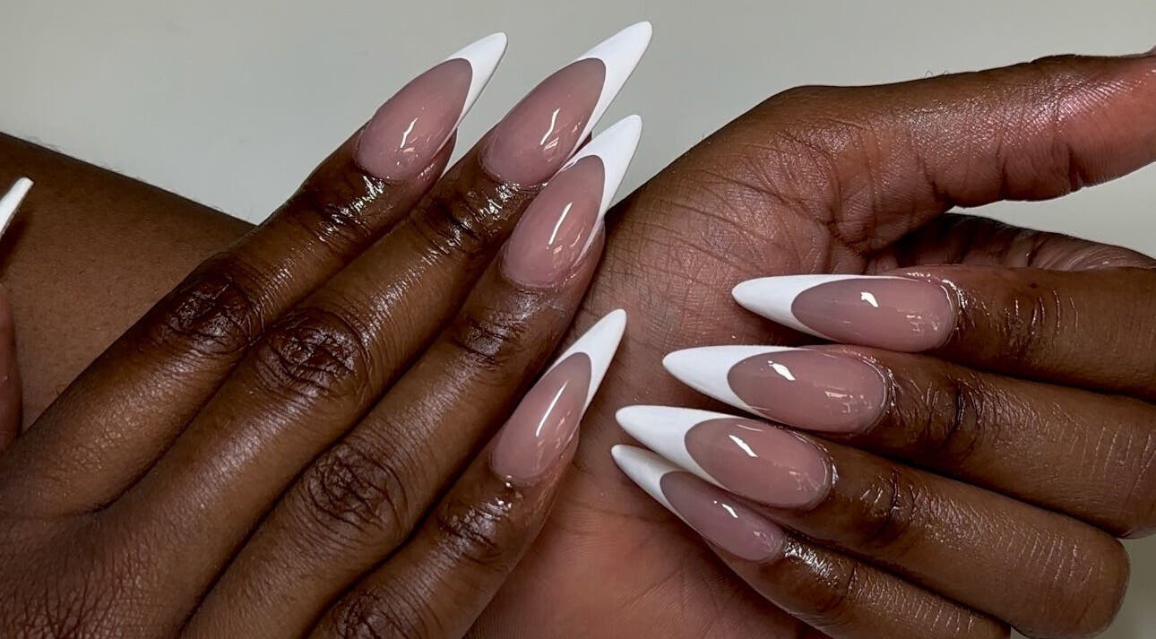 Elegant French manicure at Babe Cave Beauty in Atlanta, Georgia, US, showcasing stylish nail art.