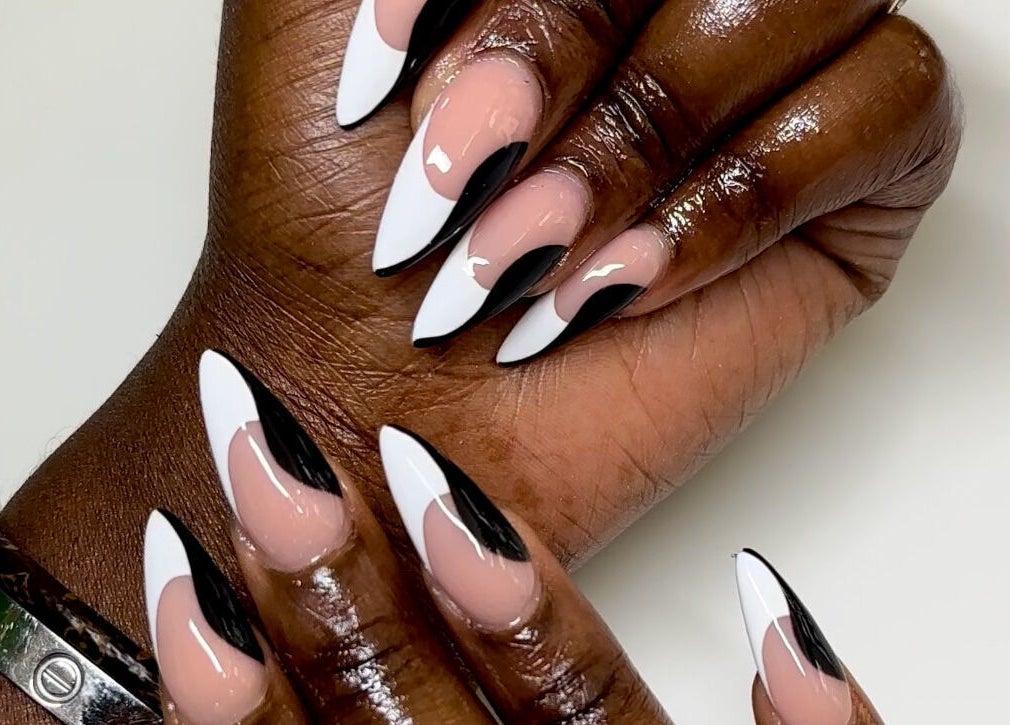 Elegant black and white nail art at Babe Cave Beauty, Atlanta, Georgia, US, showcasing stylish manicure trends.