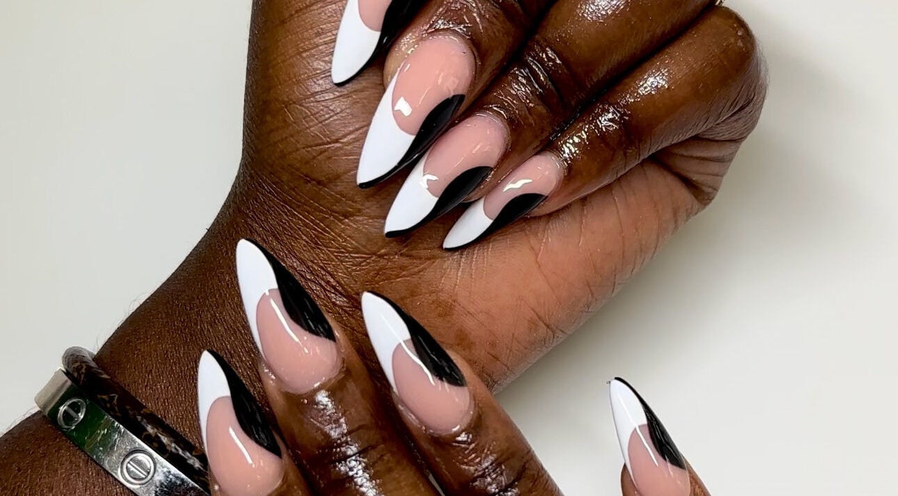 Elegant black and white nail art at Babe Cave Beauty, Atlanta, Georgia, US, showcasing stylish manicure trends.
