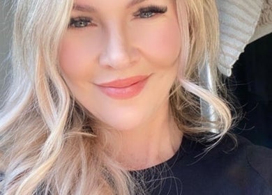 Smiling woman showcasing beauty services at Indulge Body and Beauty, Kyabram, Victoria, AU.