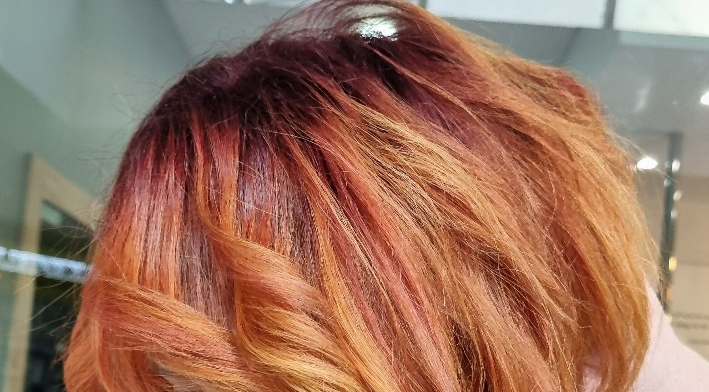 Vibrant red and orange hairstyle at Synergyhair, Durban, Kwazulu-natal, ZA salon.