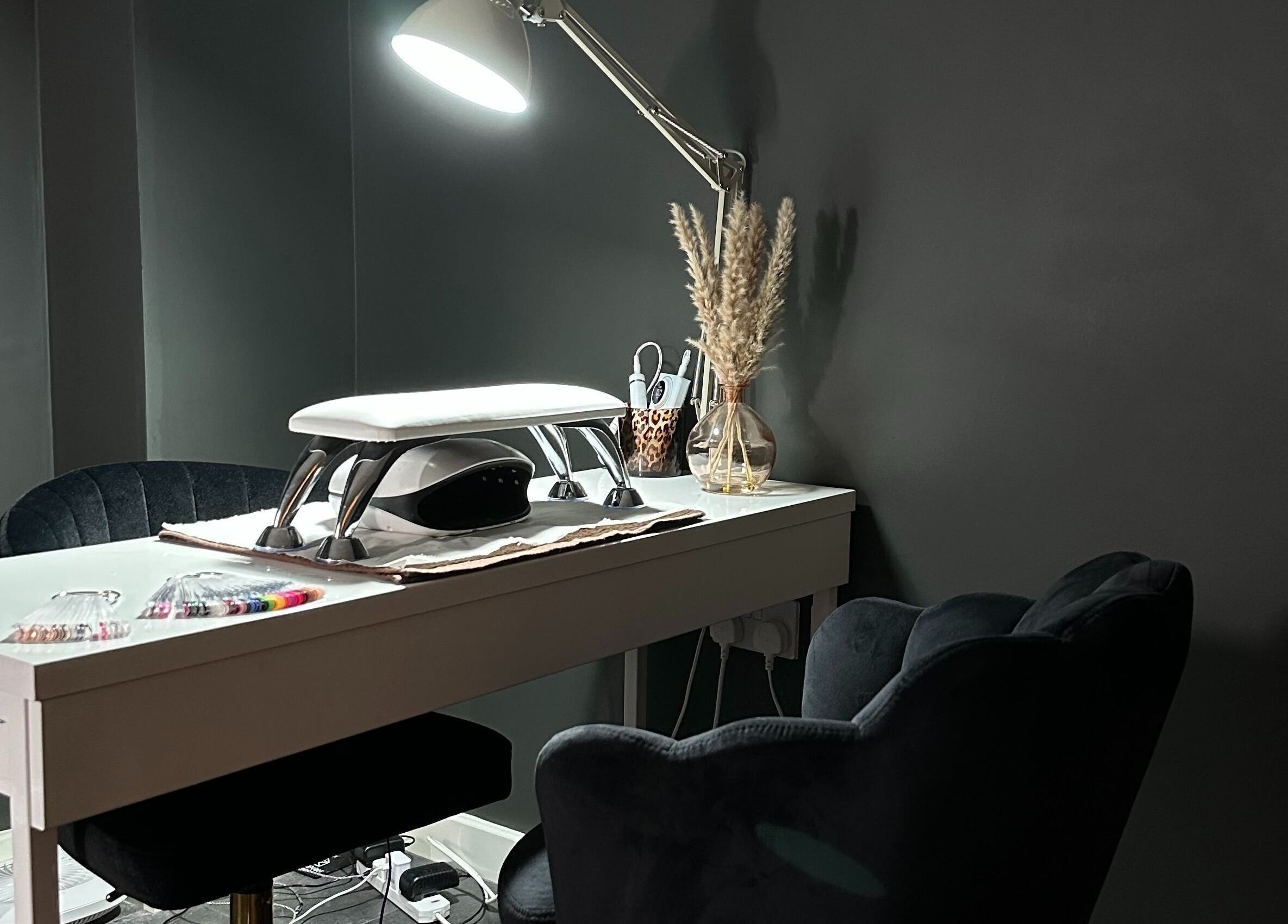 Elegant nail station at Beauty with Ellie, Somerton, England, GB. Modern design with plush seating and nail tools.