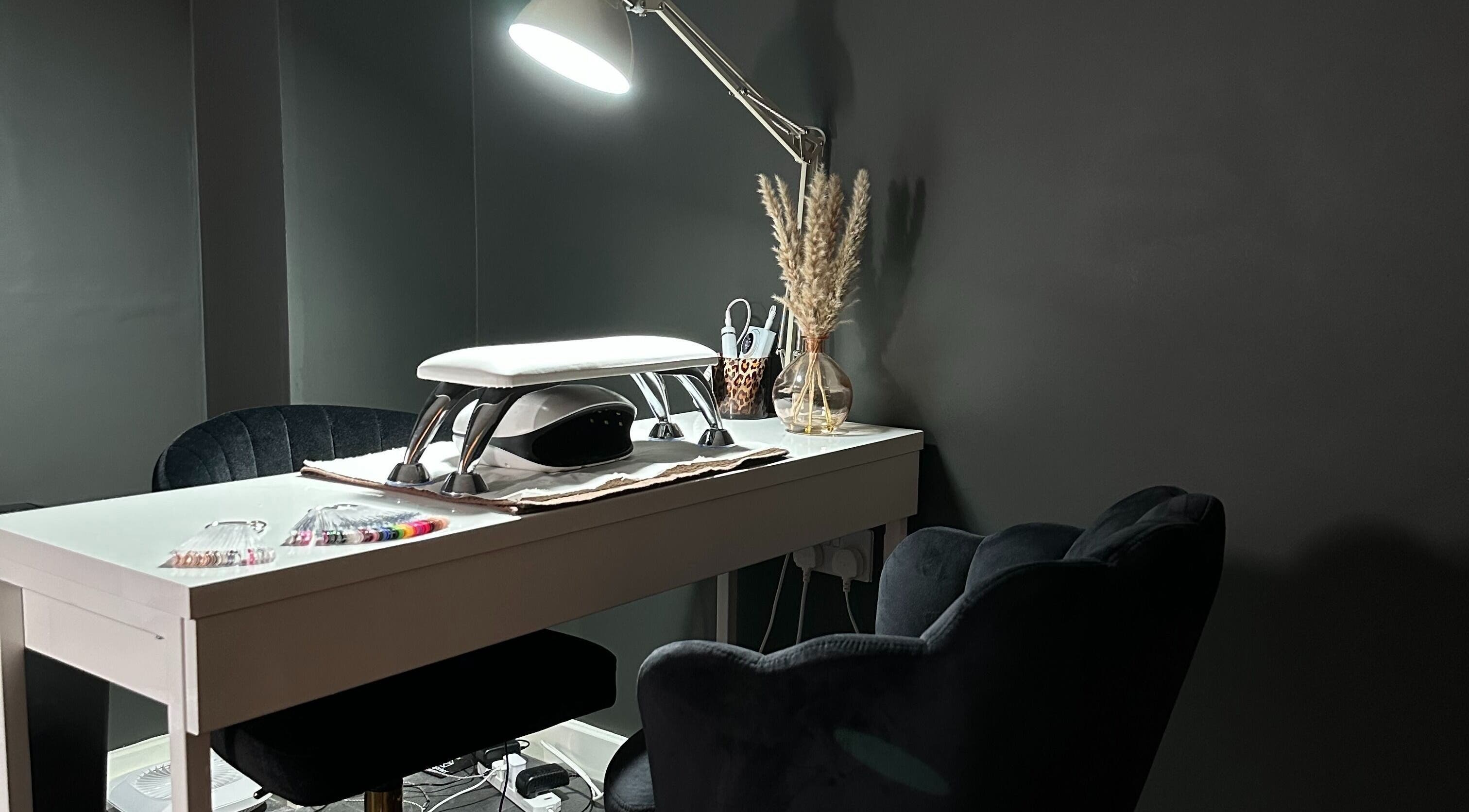 Elegant nail station at Beauty with Ellie, Somerton, England, GB. Modern design with plush seating and nail tools.