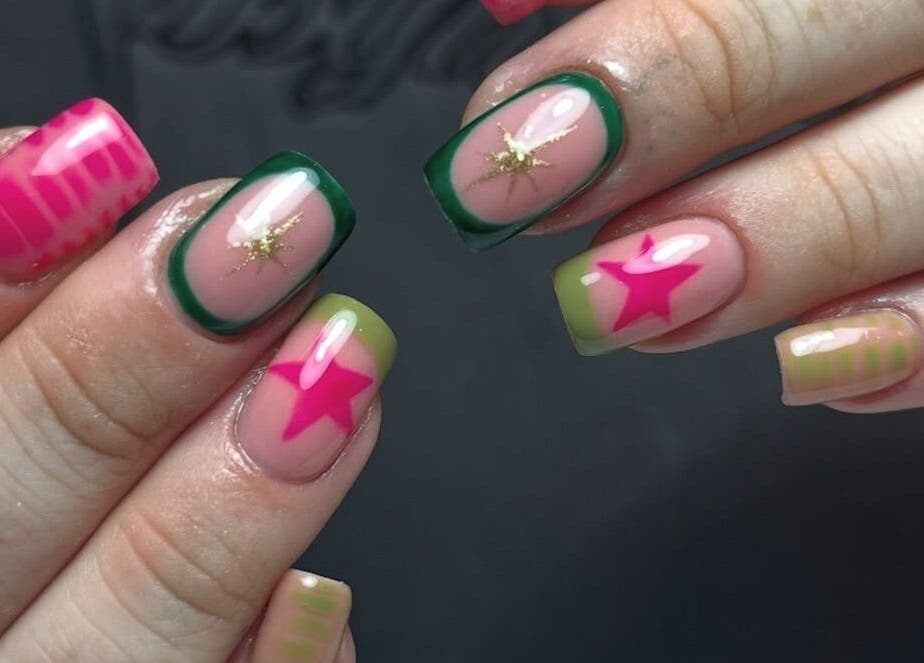 Vibrant star-patterned nails at Beauty with Ellie in Somerton, England, GB, showcasing colorful nail art.