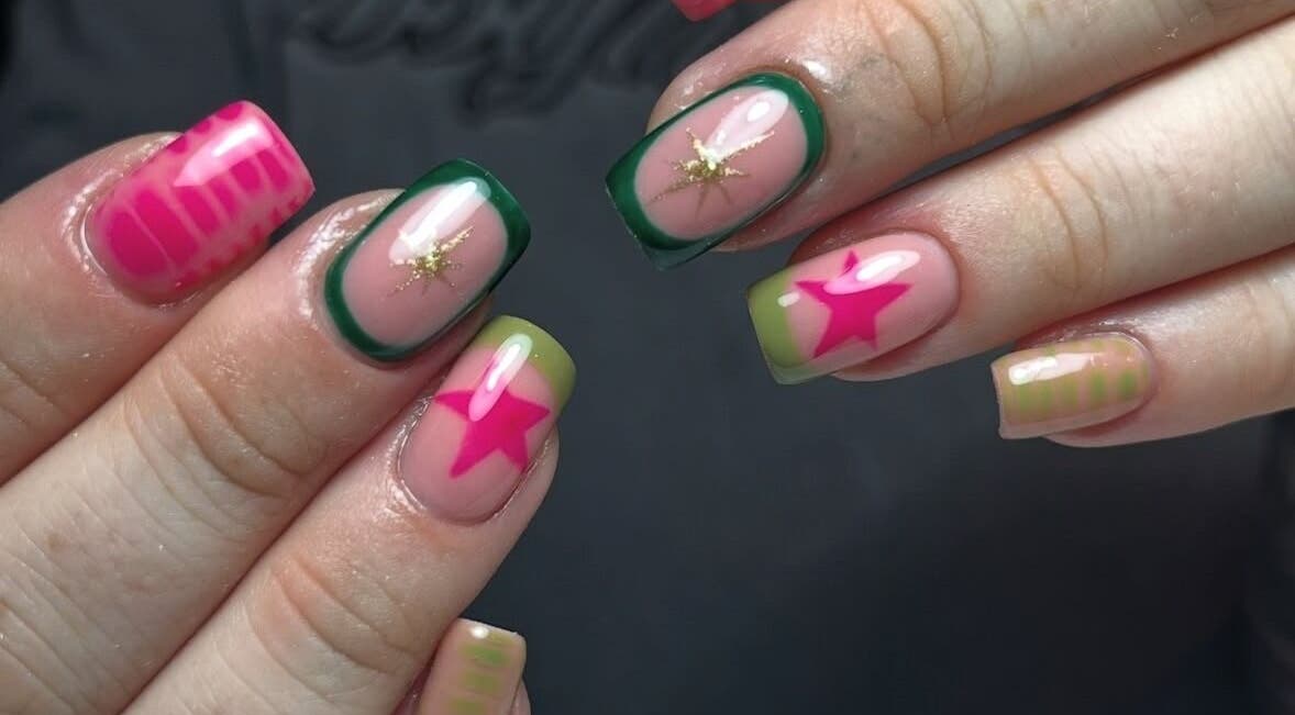 Vibrant star-patterned nails at Beauty with Ellie in Somerton, England, GB, showcasing colorful nail art.