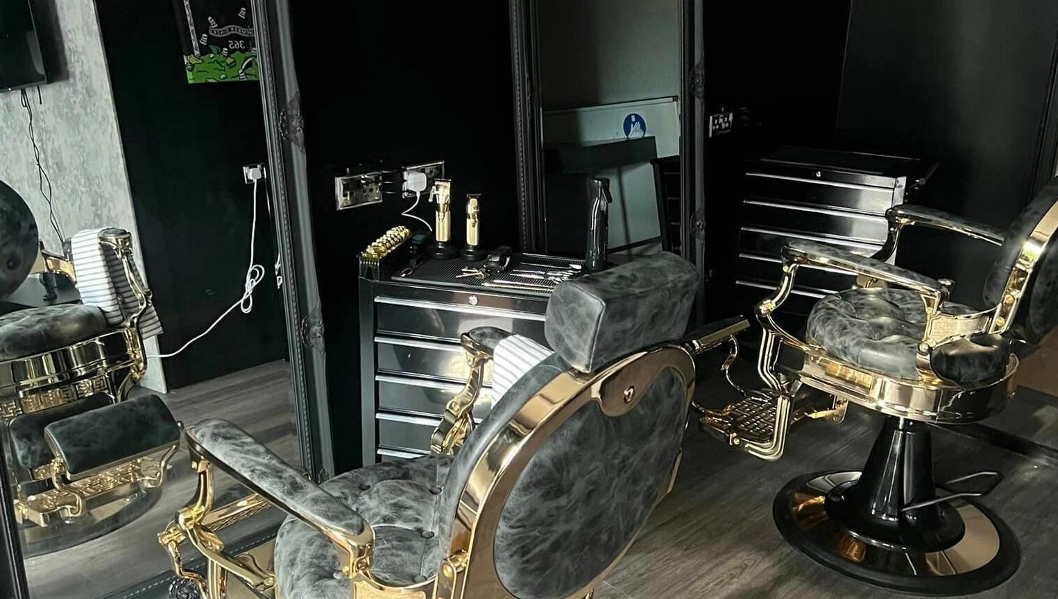 Opulent barber chairs at Grade A Barbers (Inverurie), Inverurie, Scotland, GB, showcasing sleek, stylish design.