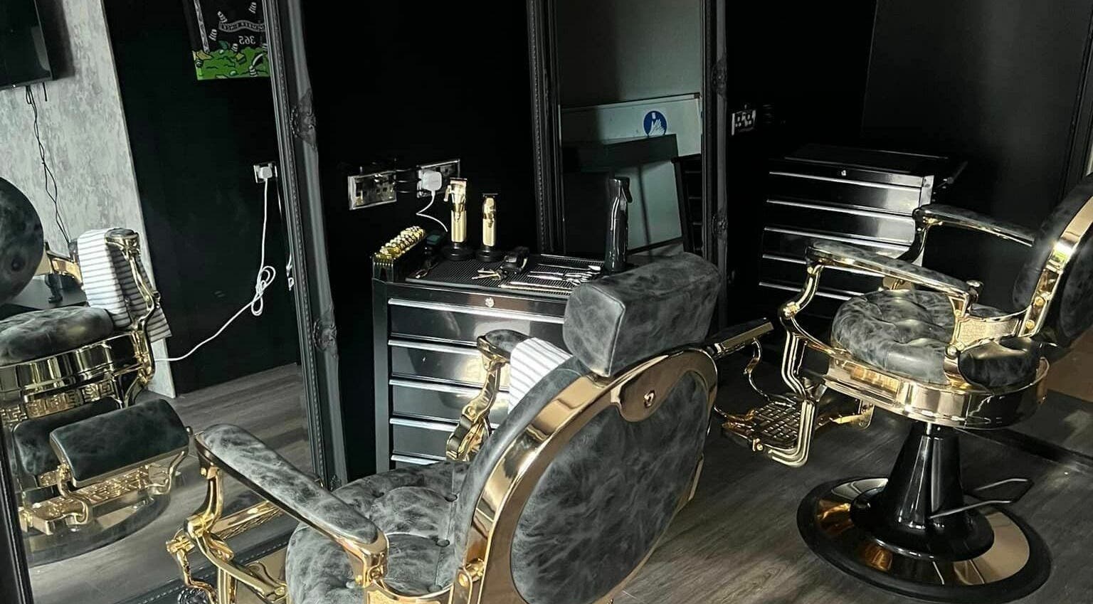 Opulent barber chairs at Grade A Barbers (Inverurie), Inverurie, Scotland, GB, showcasing sleek, stylish design.