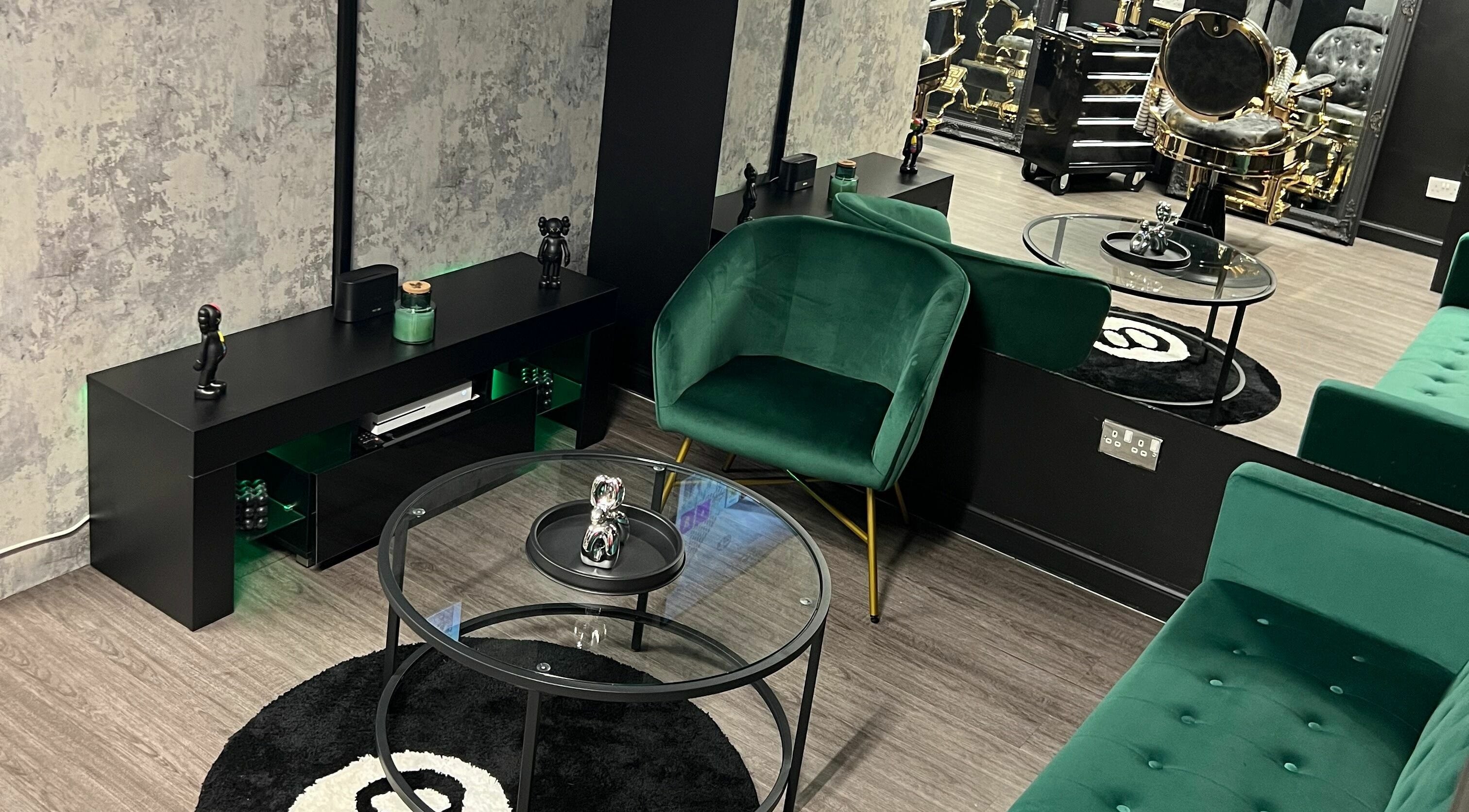 Modern waiting area at Grade A Barbers (Inverurie) with green seating, Inverurie, Scotland, GB.