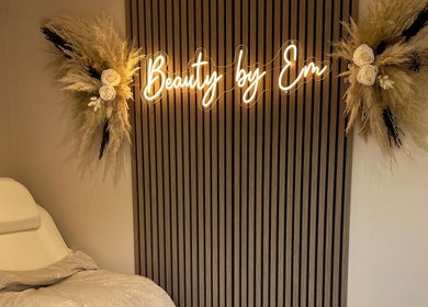 Relaxing treatment room at Beauty by Em, Clowne, England, GB with elegant decor and plush chair.