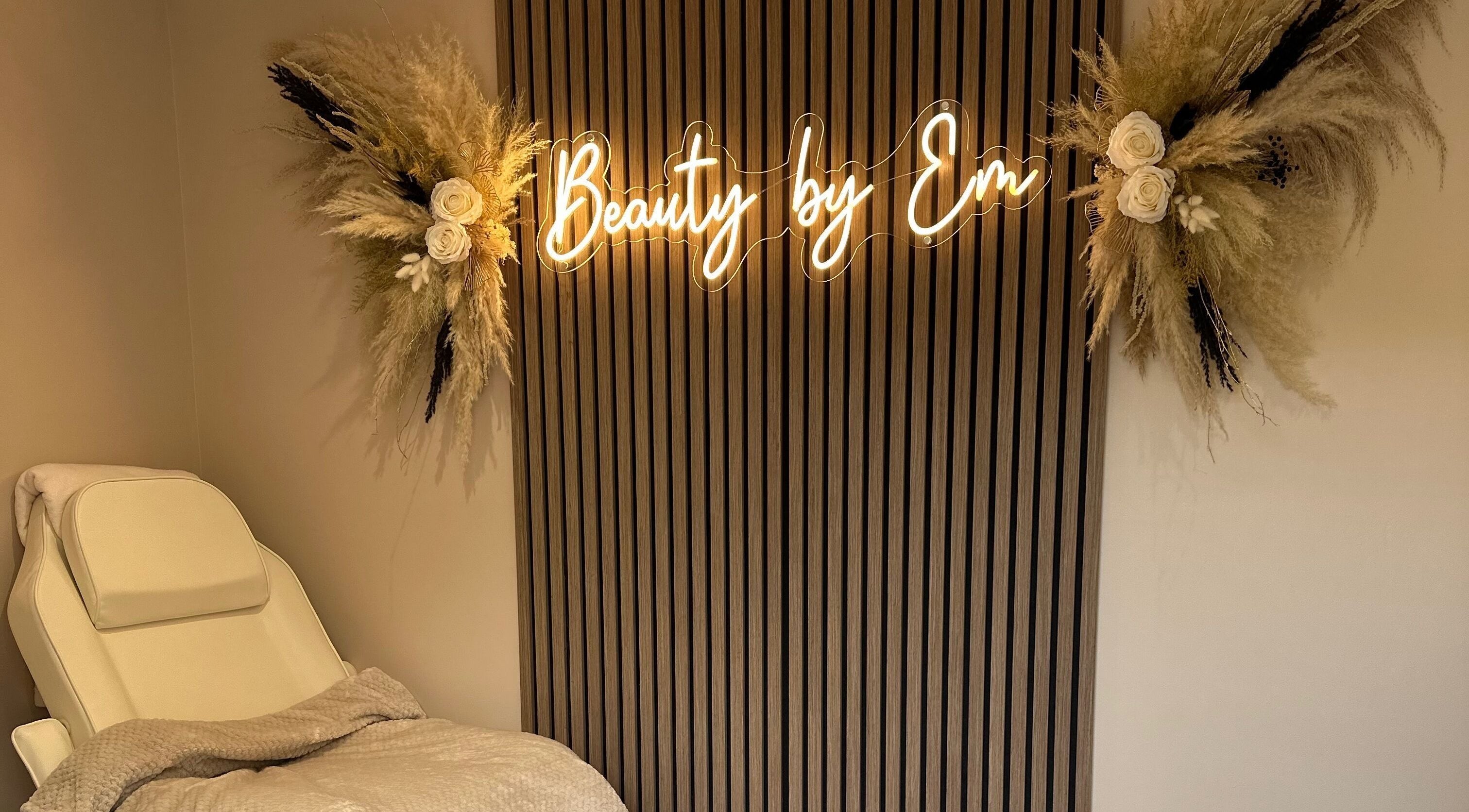 Relaxing treatment room at Beauty by Em, Clowne, England, GB with elegant decor and plush chair.