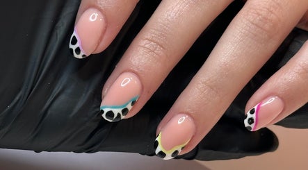 Stylish nail art at Beauty by Em in Clowne, England, GB, featuring colorful animal print tips.