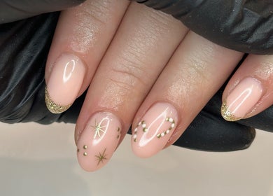 Elegant nail art with gold accents at Beauty by Em, Clowne, England, GB.