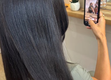 Client captures sleek new hairstyle at Alice Olivia Hair Designer in Portsmouth, England, GB.
