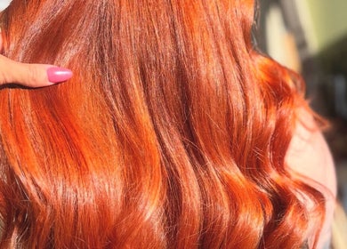Vibrant red hairstyle at Alice Olivia Hair Designer, Portsmouth, England, GB, reflecting expert salon services.